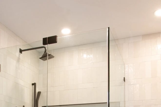 Recessed lights above a shower enclosure