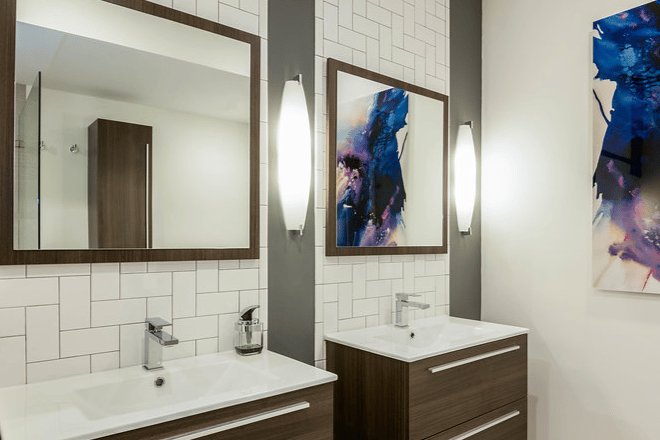 Two vanities and mirrors in bathroom remodel
