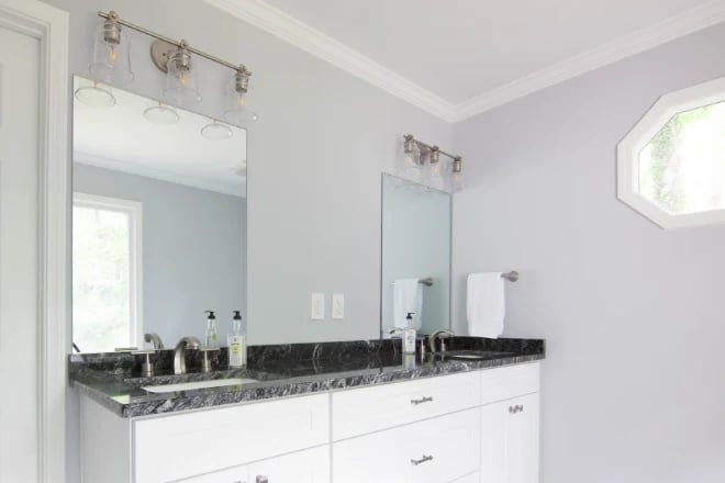 A bathroom with soft gray paint