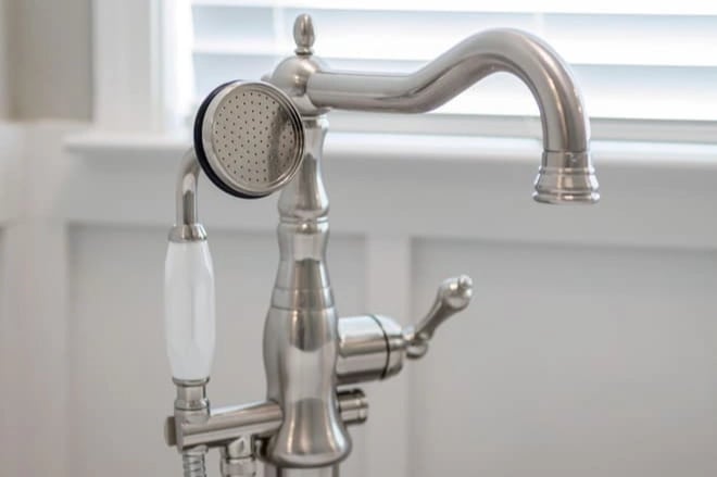 A bathtub faucet with extra features, like a pull-out sprayer