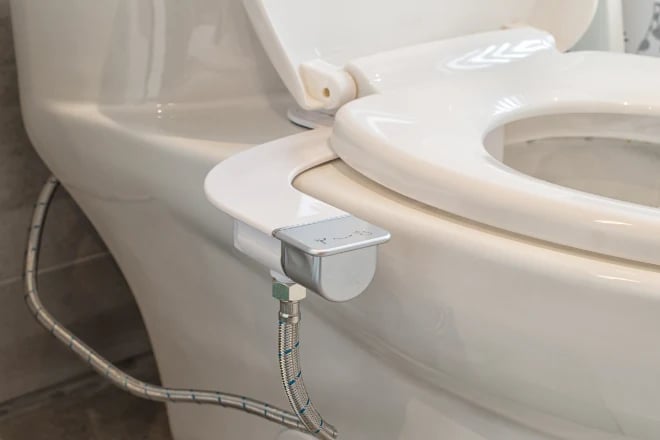 A bidet attachment that attaches to underside of toilet