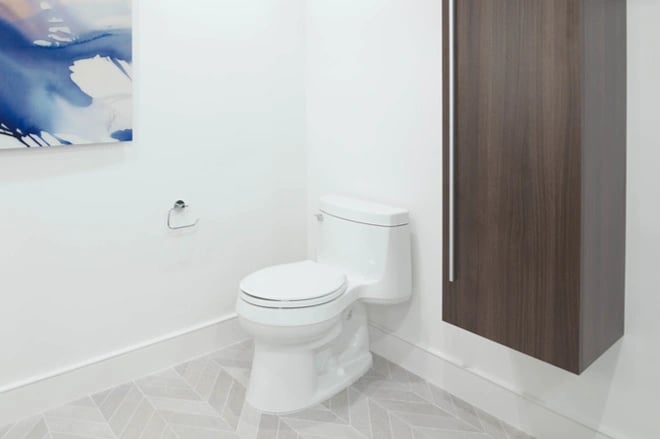 A comfort height toilet in a modern bathroom