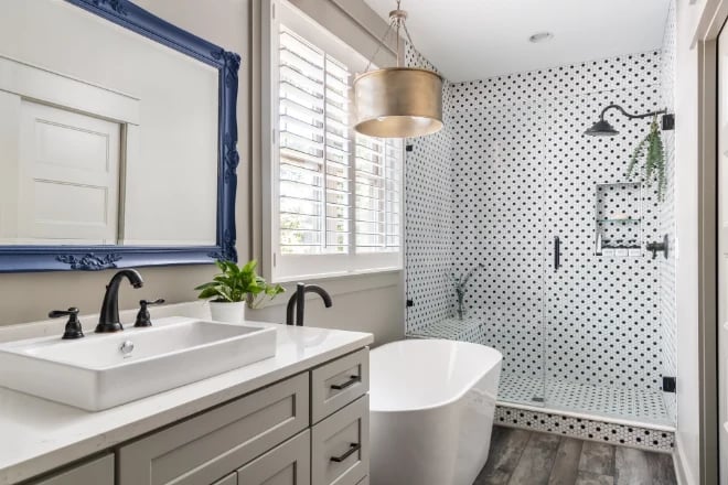 A contemporary interior design style bathroom with a blue-framed mirror