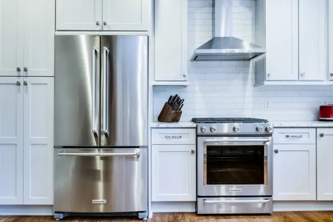A fridge and an oven with a range hood