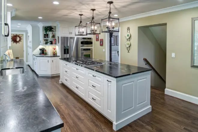 A kitchen remodel with hardwood flooring