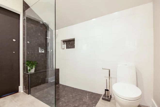 A large bathroom with a walk-in shower area