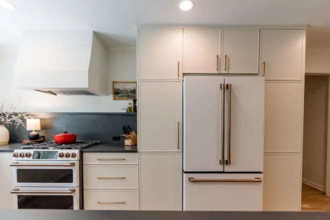 A luxury oven and fridge in a kitchen remodel