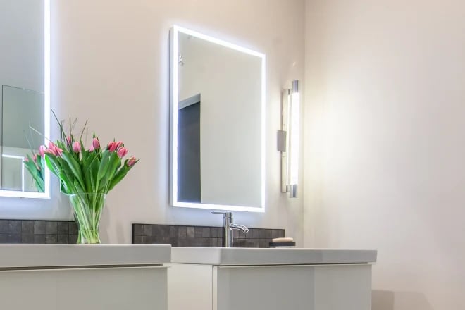 A mirror surrounded by LED lighting
