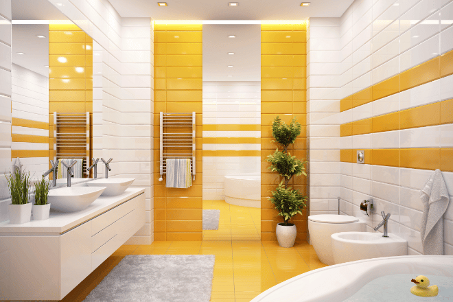 A modern bathroom featuring white tile bordered with bright orange-colored tile