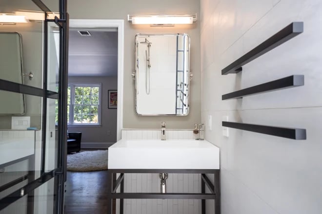 A specialty bathroom mirror that tilts