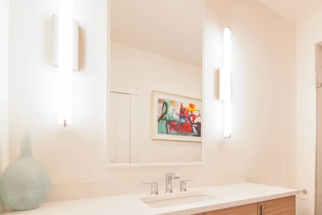 A vanity mirror in a bathroom remodeled by Ranney Blair Remodeling