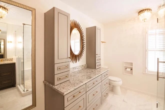 A vanity with twin storage toers utilizing vertical space