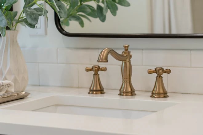 A widespread style faucet with cross handles