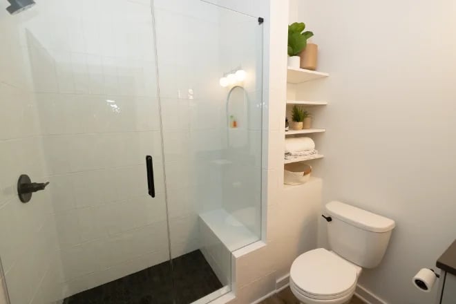 Shelving in a nook next to the toilet