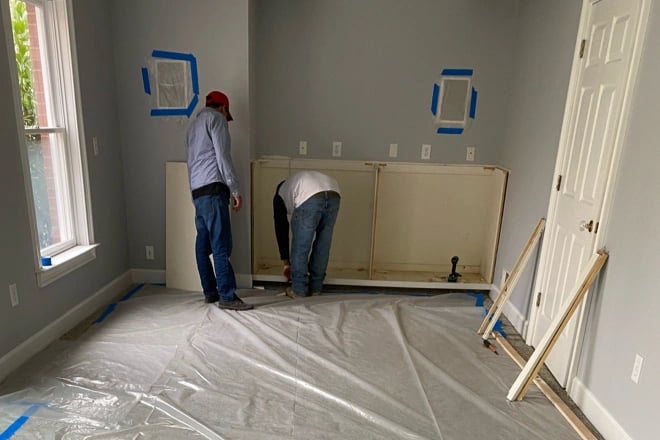 Two Ranney Blair employees working on a remodeling project