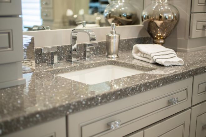 A bathroom sink with a terrazzo style countertop
