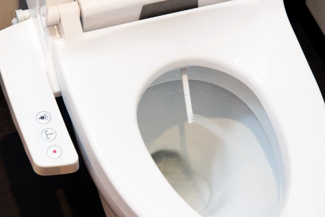 a bidet toilet with a control panel