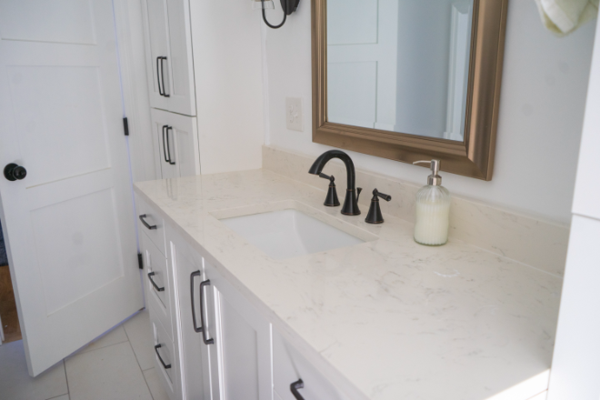 A cream-colored bathroom countertop installed by Ranney Blair
