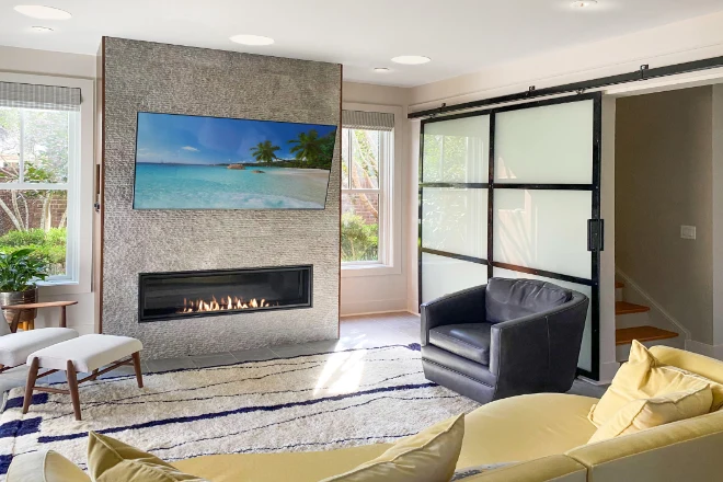 A basement remodel featuring a fireplace