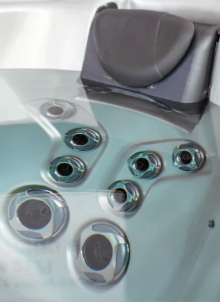 A close up of the jet nozzles in a jetted tub