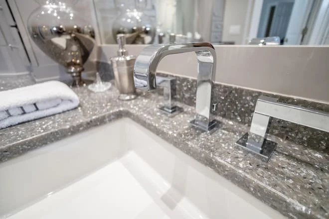 A granite countertop elevates this bathroom design