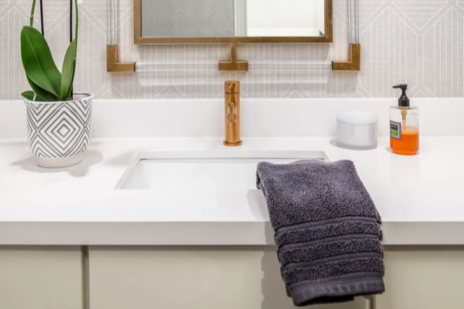 A quartz countertop provides durability in this bathroom remodel