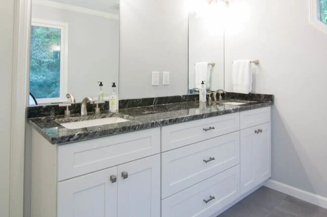 Granite countertops elevate this double sink bathroom vanity
