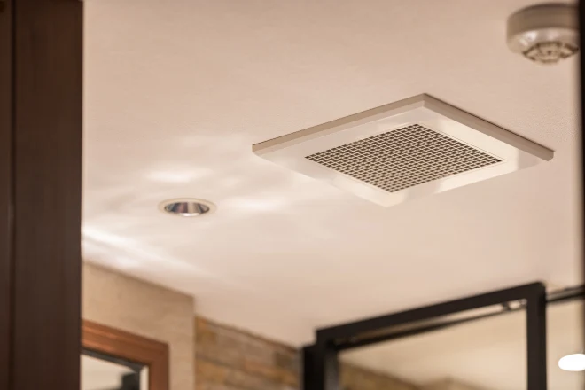 Ventilation fan in a bathroom ceiling