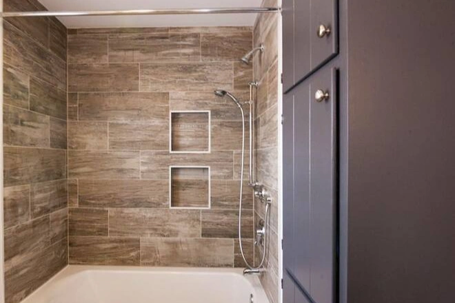 Wood look tiles in a newly remodeled shower
