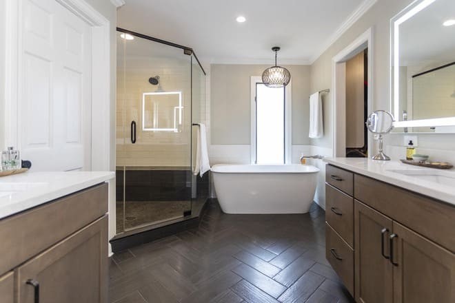 A remodeled bathroom featuring wood-look ceramic tile flooring